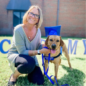 Sully poses in her graduation cap with Cheryl.