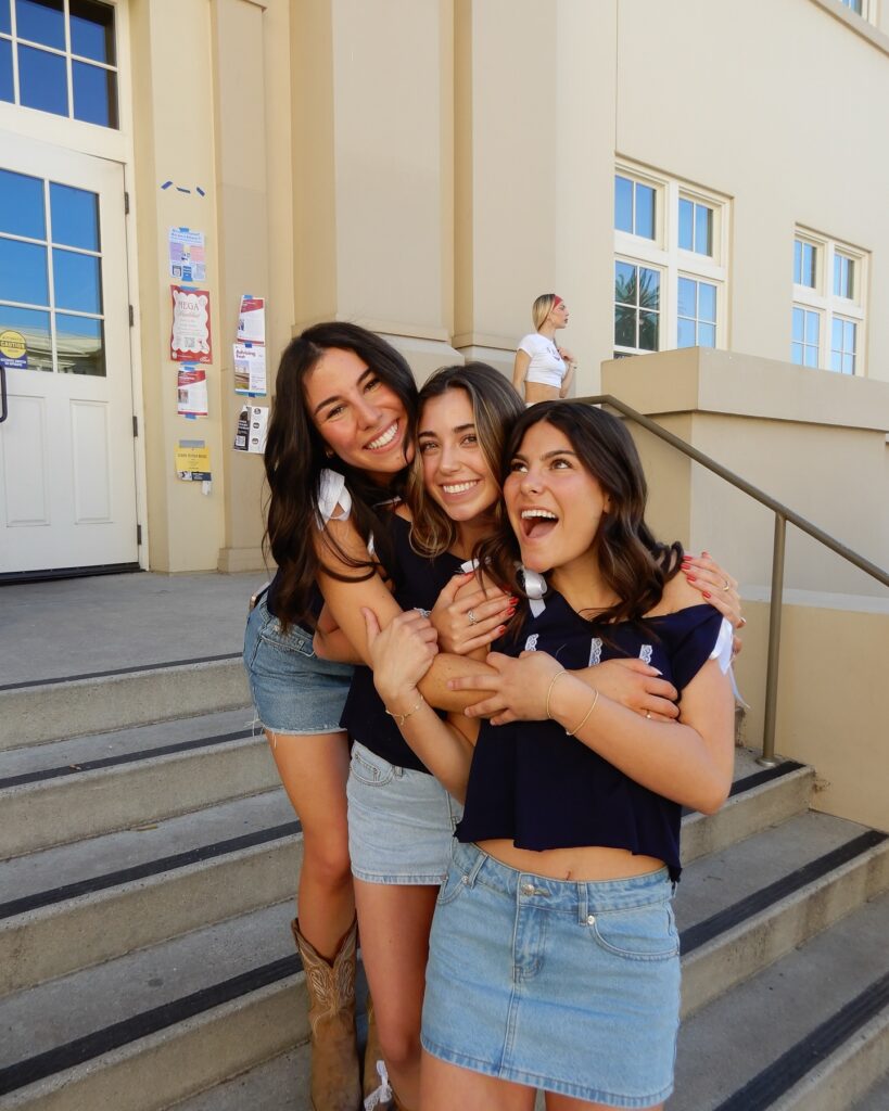 Three Delta Gamma ladies hugging