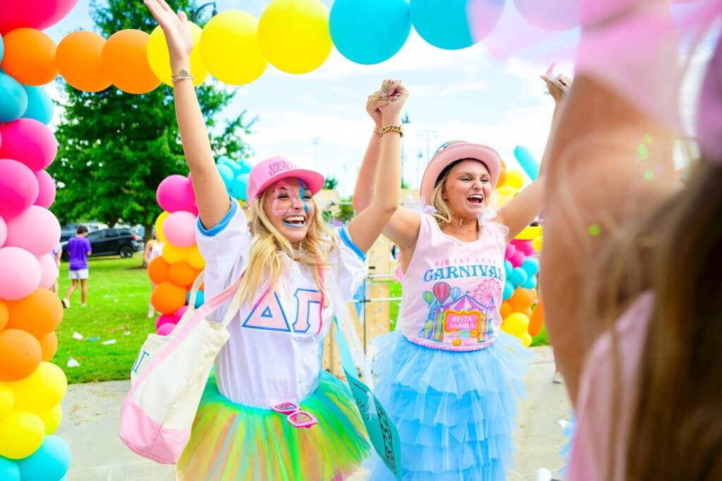 Bright photo of two Delta Gamma's surrounded by balloons