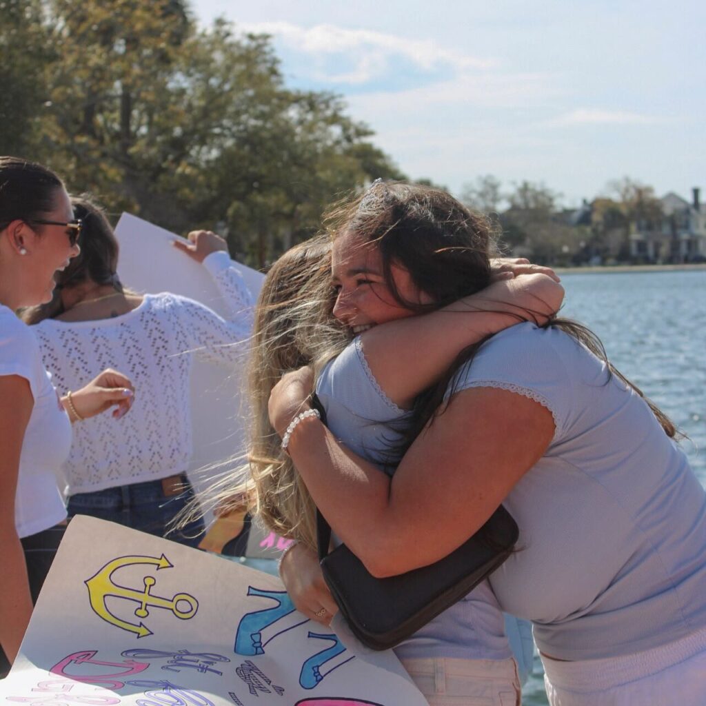 Two Delta Gamma sisters hugging