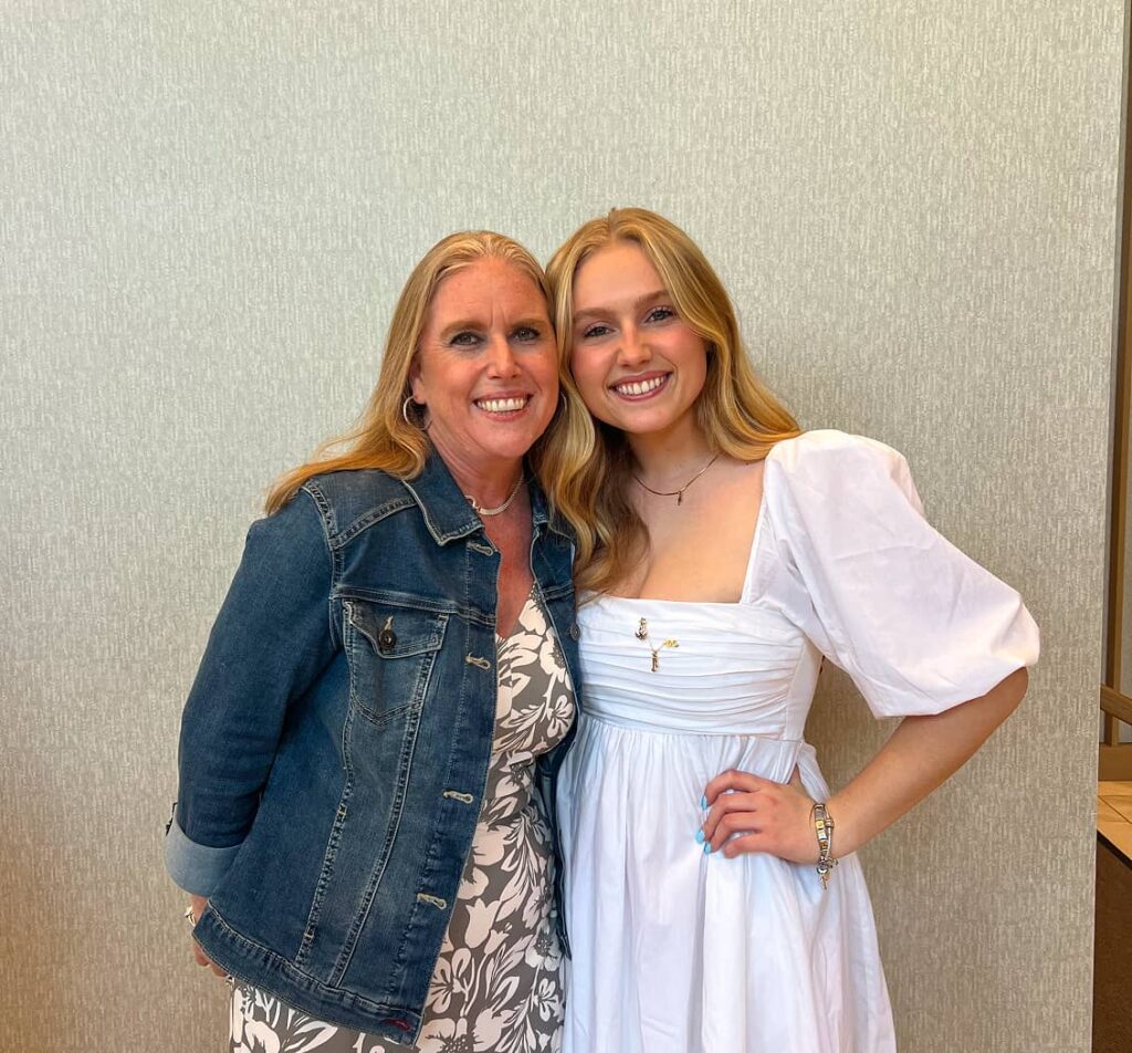 Alumnae members of two posing for photo