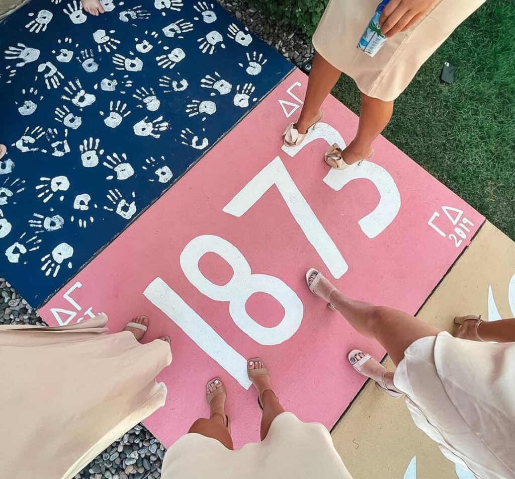 Painted sidewalk with 1873 on it in white