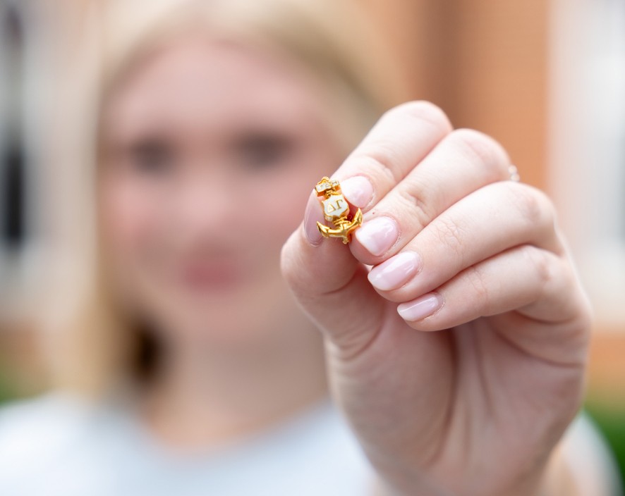 Woman holding pin of DG anchor