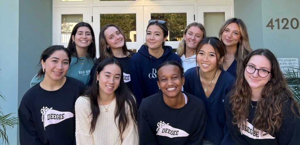 Group of girls wearing DeeGee sweatshirt