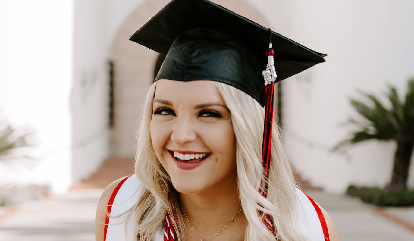 DG graduate in cap and stoll