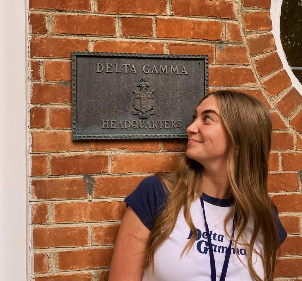 Girl looking at DG plaque