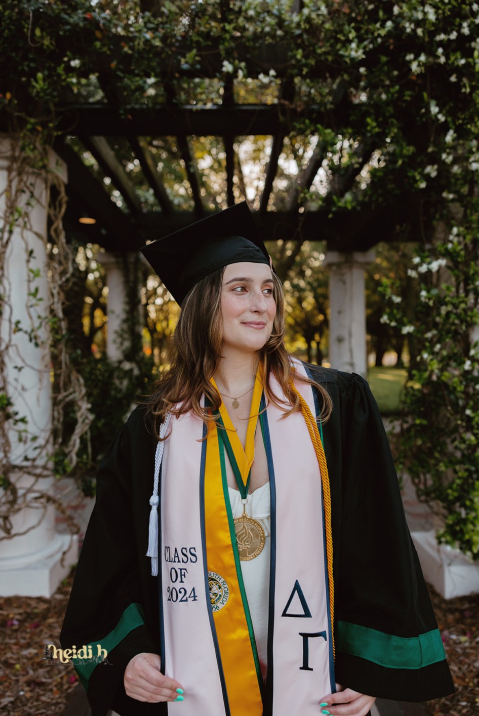 DG graduate wearing cap and gown