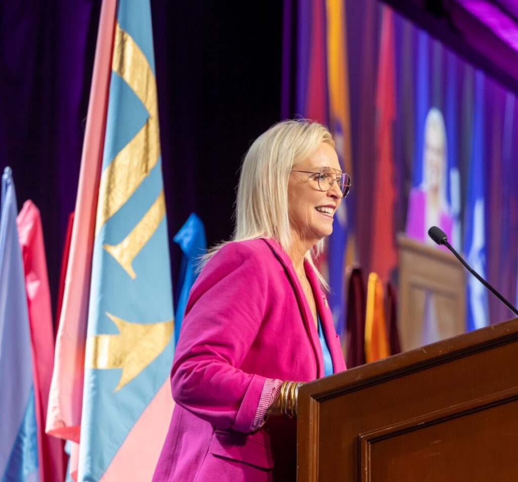 Delta Gamma member presenting and speaking at podium