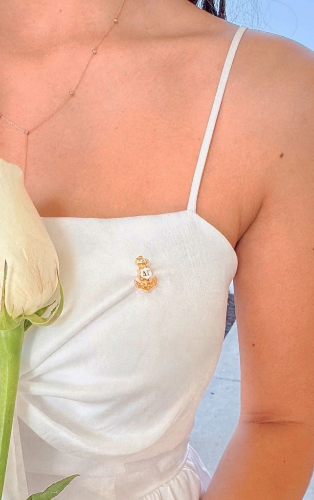 DG anchor pin on girls dress