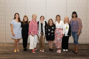 A group of woman standing and posing together 