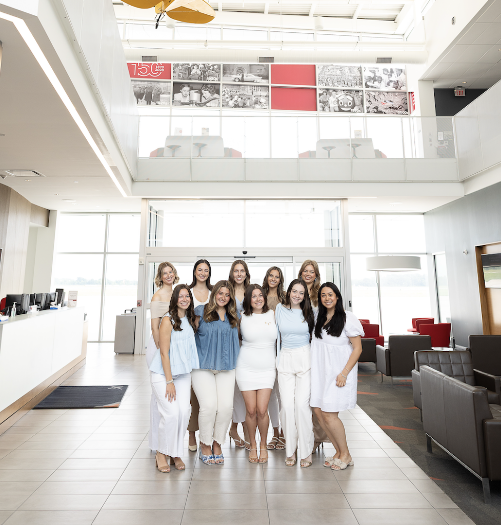 CDCs in an airport posing for a photo